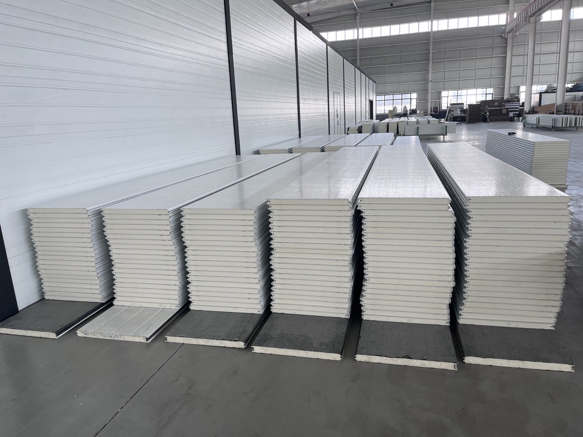 Insulated garage door panel stacks in Symphony factory